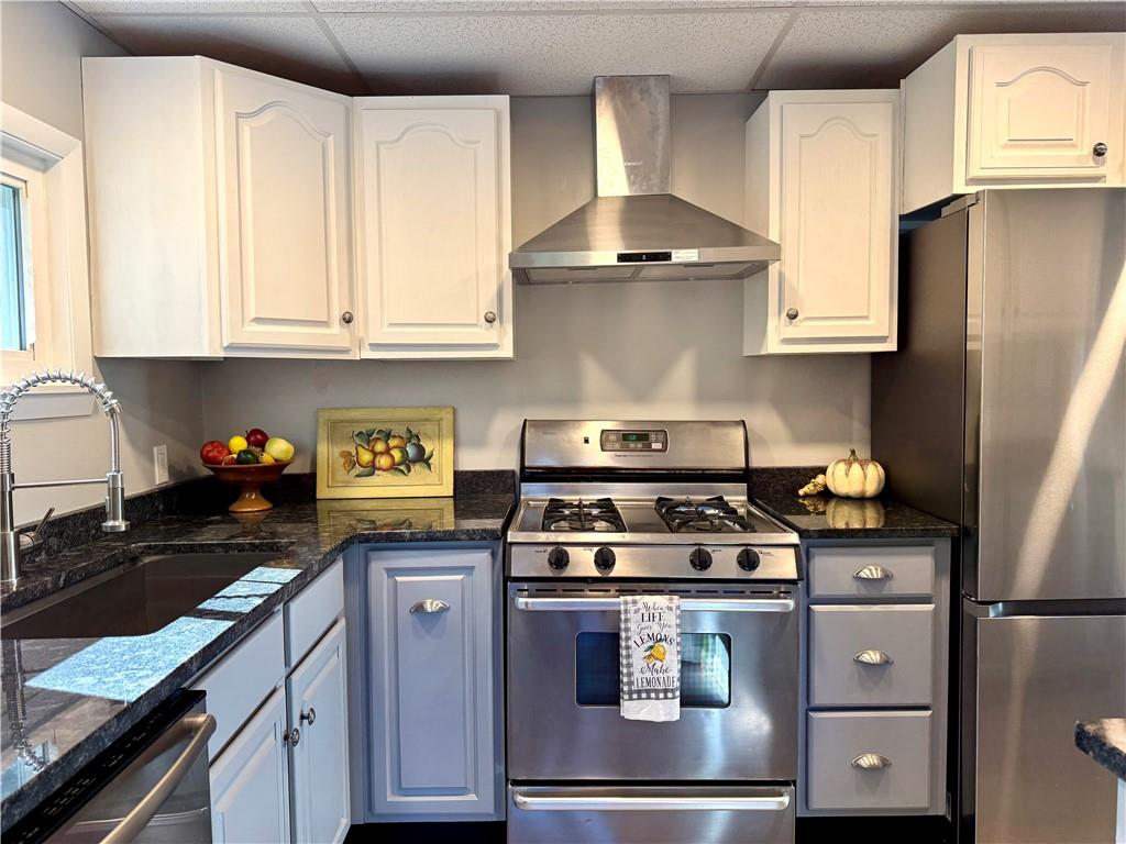 532 North Elm Street Butler, PA 16001 - Photo 7 of 31 a kitchen with granite countertop a stove sink and cabinets