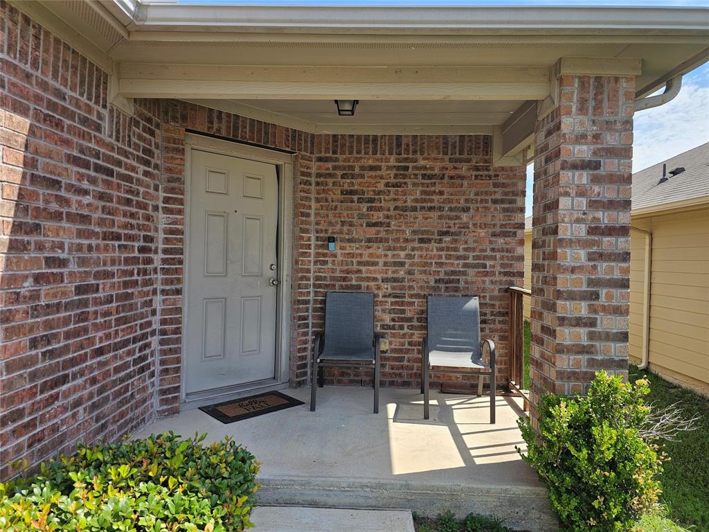 11640 Cambrian Road Manor, TX 78653 - Photo 2 of 15 a front view of a house with a garden