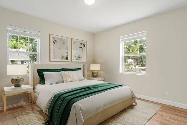 a bedroom with a large bed and a window