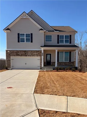 a front view of a house with yard