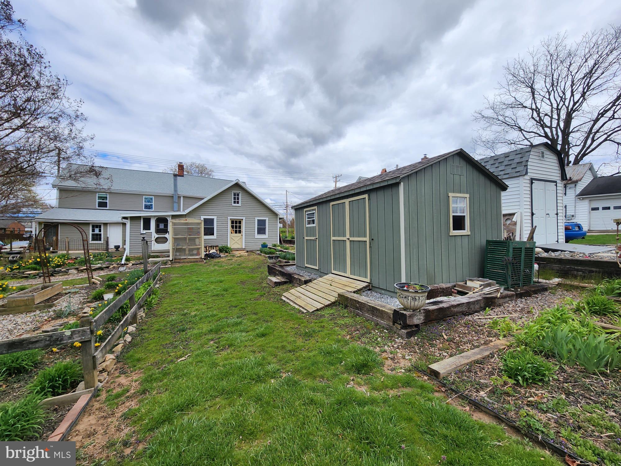 707 Old Liberty Road Sykesville, MD 21784 - Photo 11 of 31 a view of a house with backyard and sitting area