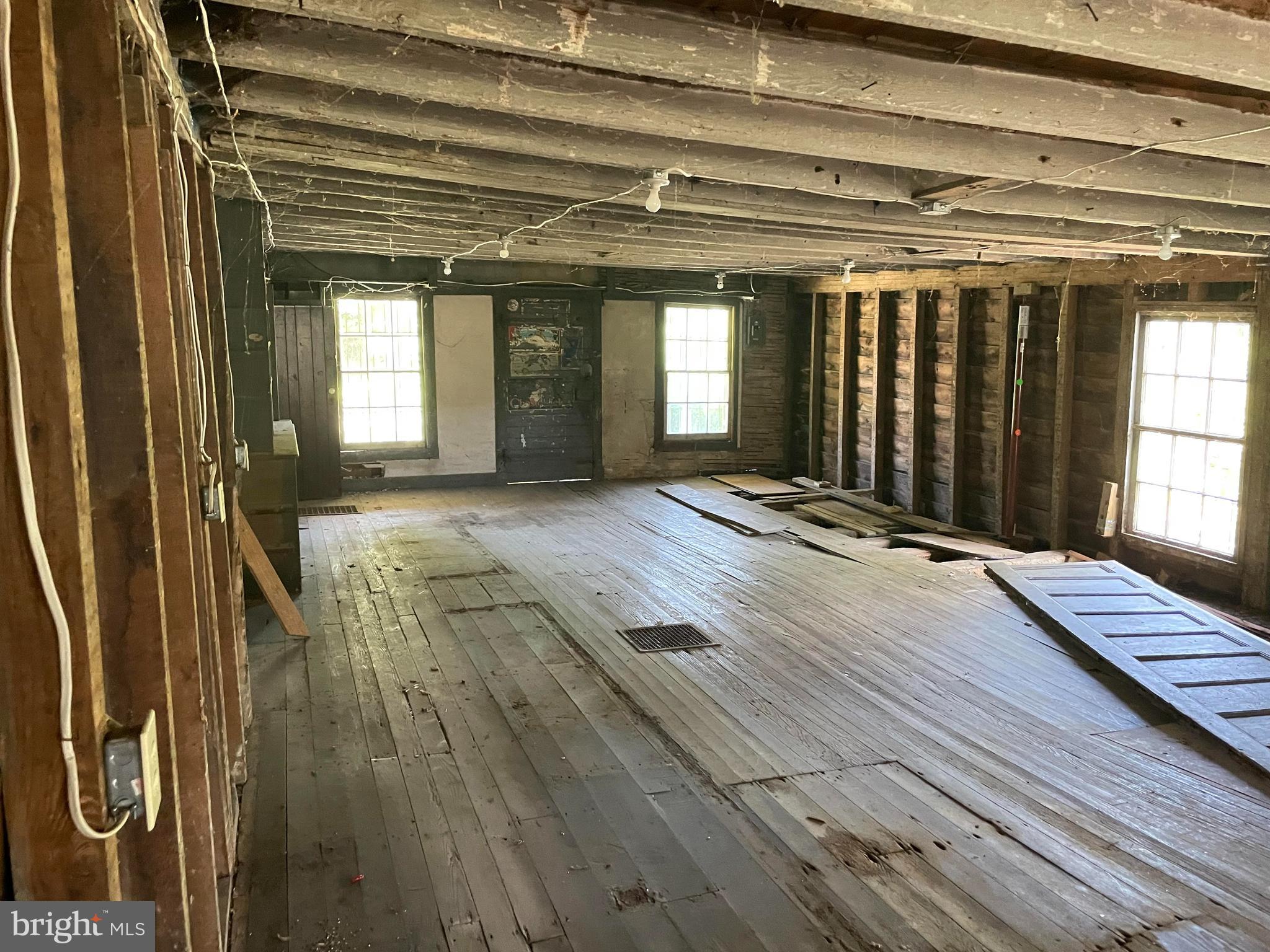 707 Old Liberty Road Sykesville, MD 21784 - Photo 27 of 31 a view of an empty room with wooden floor and a window