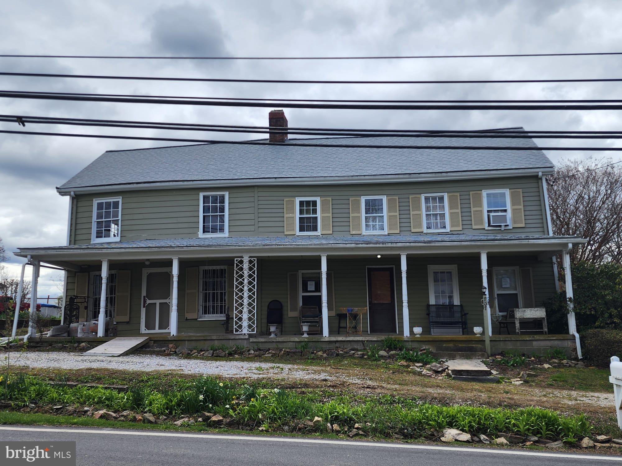 707 Old Liberty Road Sykesville, MD 21784 - Photo 3 of 31 a front view of a house with garden and plants