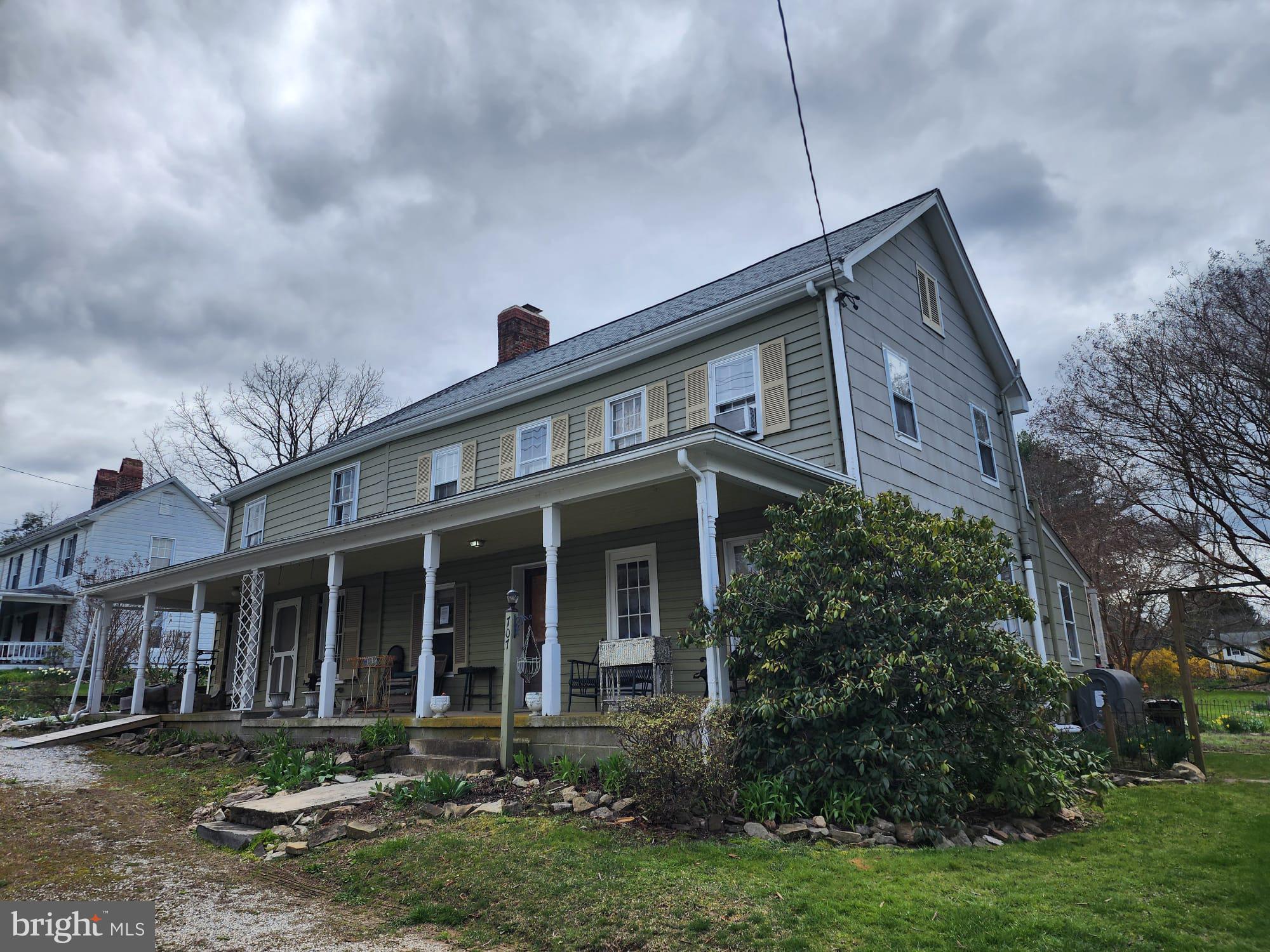 707 Old Liberty Road Sykesville, MD 21784 - Photo 4 of 31 a front view of a house with garden