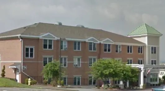 42 Vernon Street Worcester, MA 01610 - Photo 2 of 6 a front view of a house with a yard and potted plants