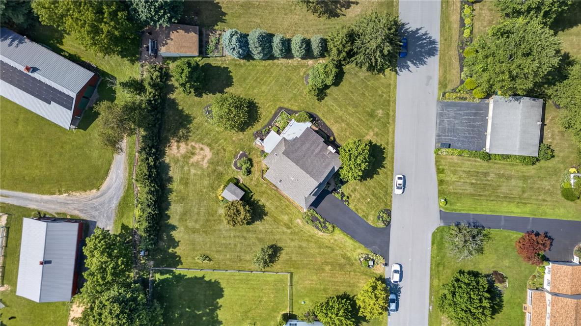 6467 Abbey Road Wind Gap, PA 18091 - Photo 4 of 46 An aerial perspective reveals a private residence nestled amidst lush green lawns and mature trees.