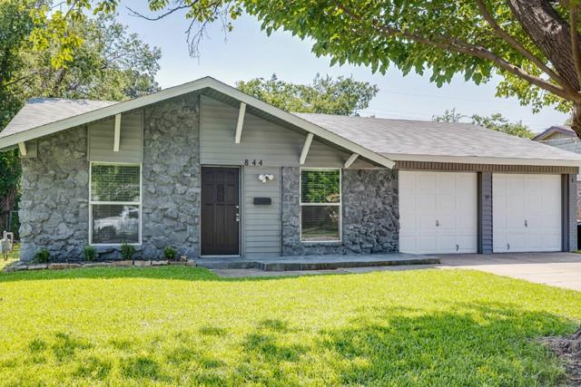 a front view of the house with a yard