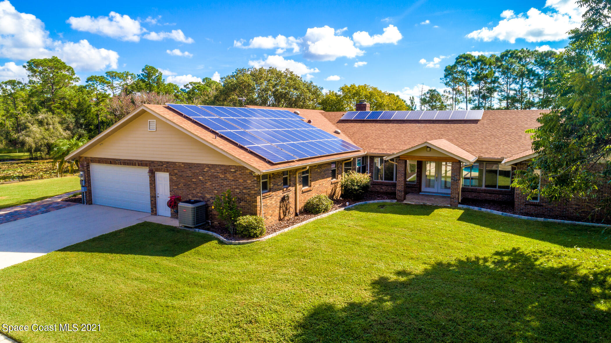 1390 Friday Road Cocoa, FL 32926 - Photo 1 of 69 a view of house with yard and swimming pool