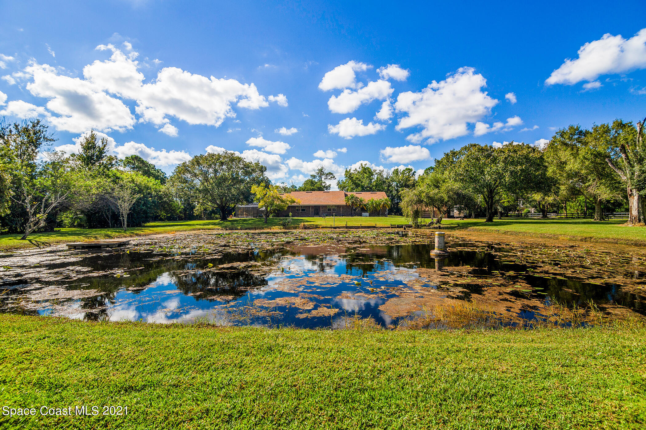 1390 Friday Road Cocoa, FL 32926 - Photo 11 of 69 a view of a lake with houses