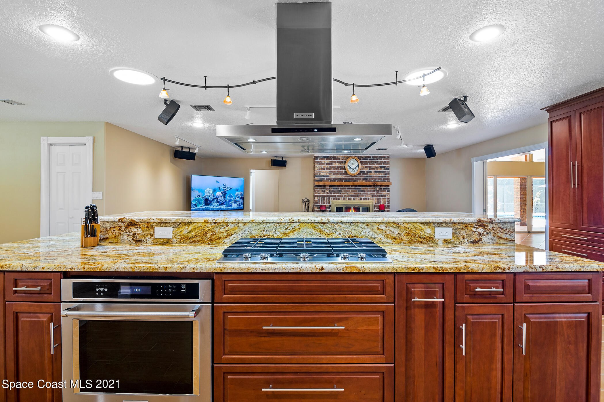 1390 Friday Road Cocoa, FL 32926 - Photo 17 of 69 a kitchen with stainless steel appliances granite countertop a stove and a sink