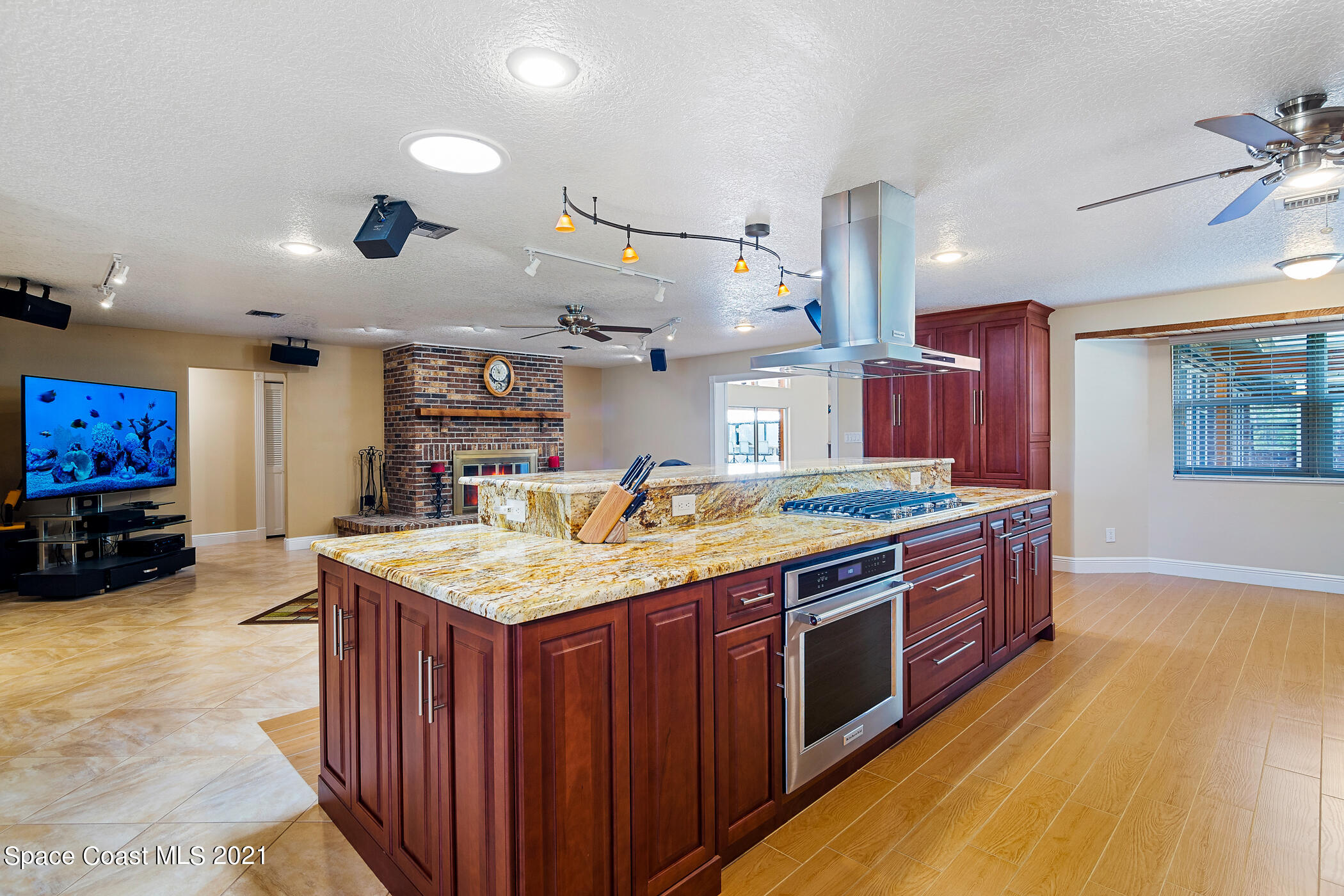 1390 Friday Road Cocoa, FL 32926 - Photo 18 of 69 a kitchen with stainless steel appliances granite countertop a stove and a sink