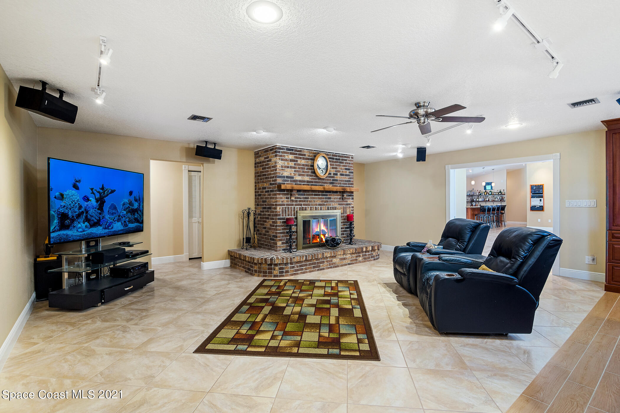 1390 Friday Road Cocoa, FL 32926 - Photo 20 of 69 a living room with furniture and a flat screen tv