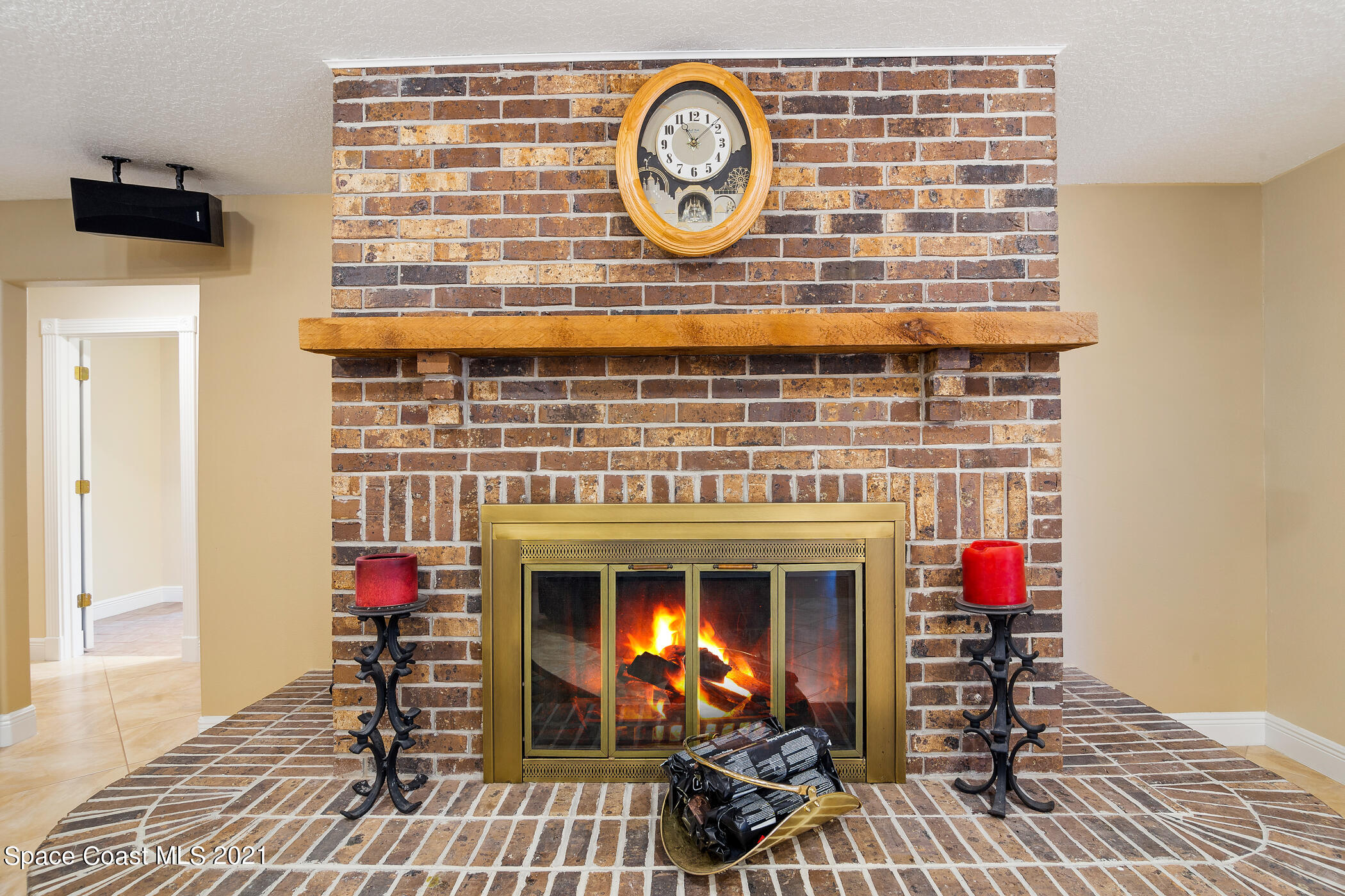 1390 Friday Road Cocoa, FL 32926 - Photo 21 of 69 a living room with furniture a clock and a fireplace