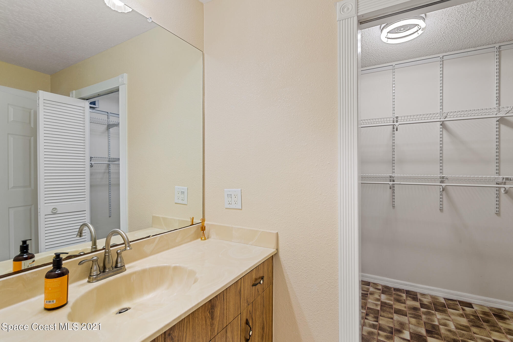 1390 Friday Road Cocoa, FL 32926 - Photo 24 of 69 a bathroom with a sink and a mirror