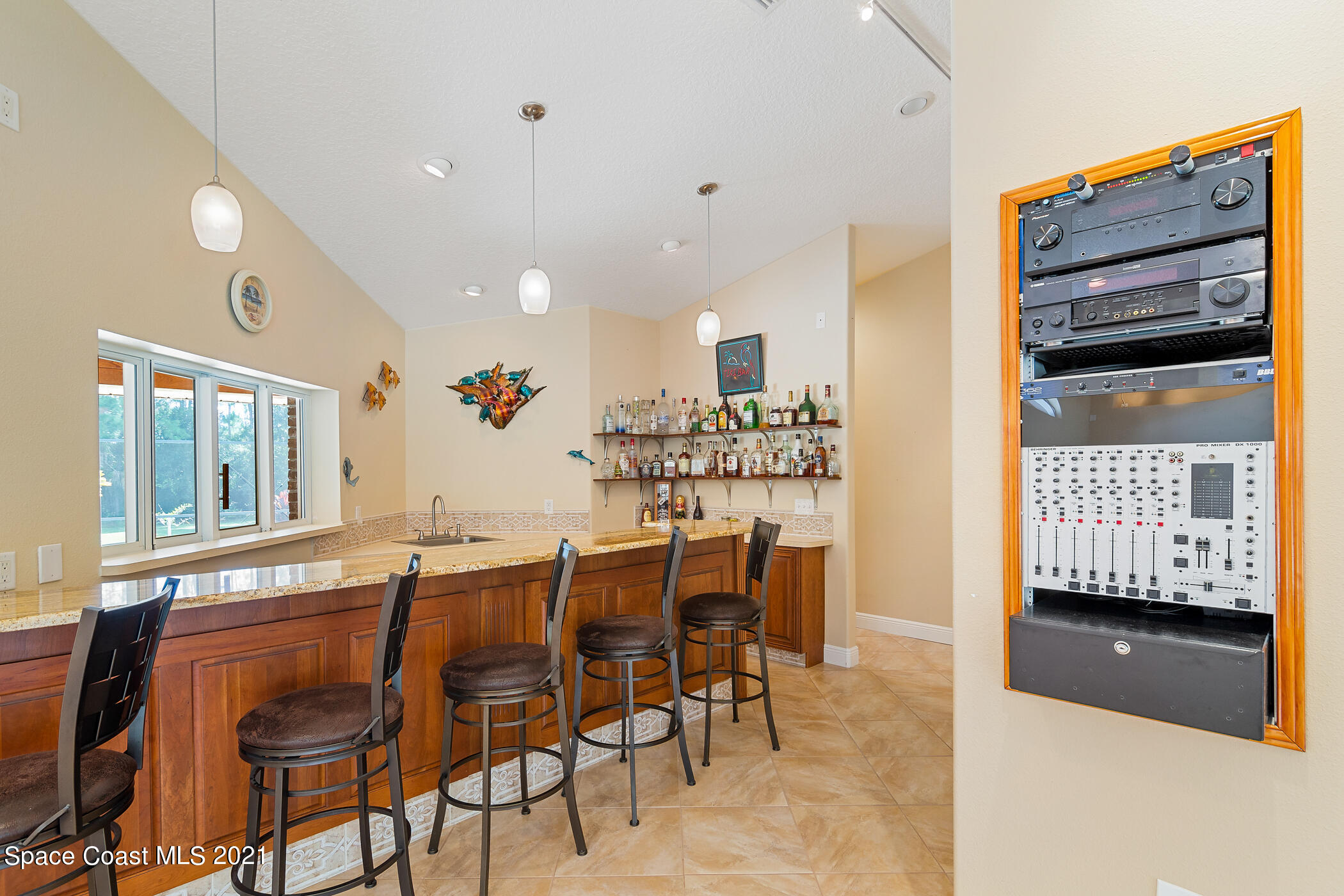1390 Friday Road Cocoa, FL 32926 - Photo 30 of 69 a view of a dining room with furniture and chandelier