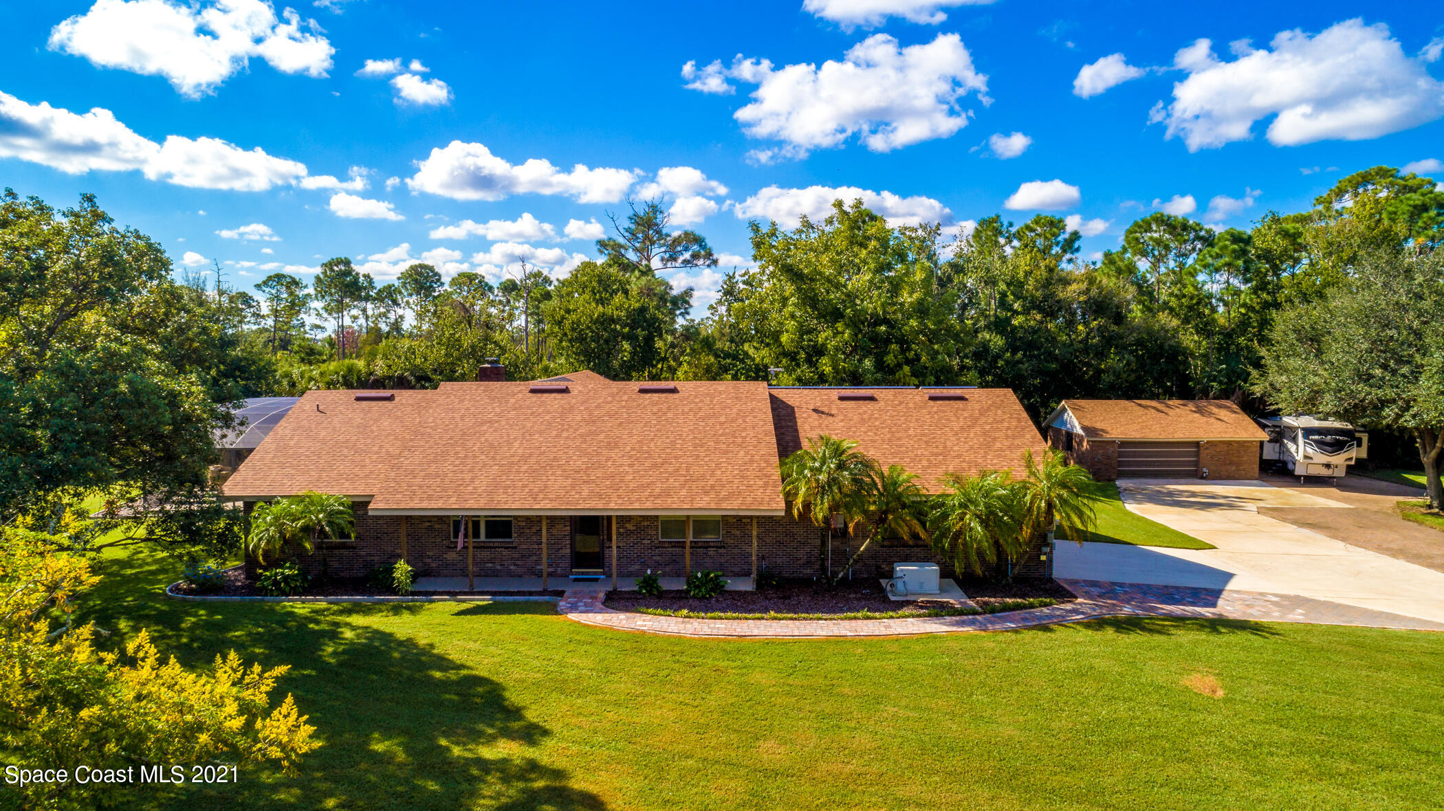 1390 Friday Road Cocoa, FL 32926 - Photo 4 of 69 a view of a swimming pool and lounge chairs