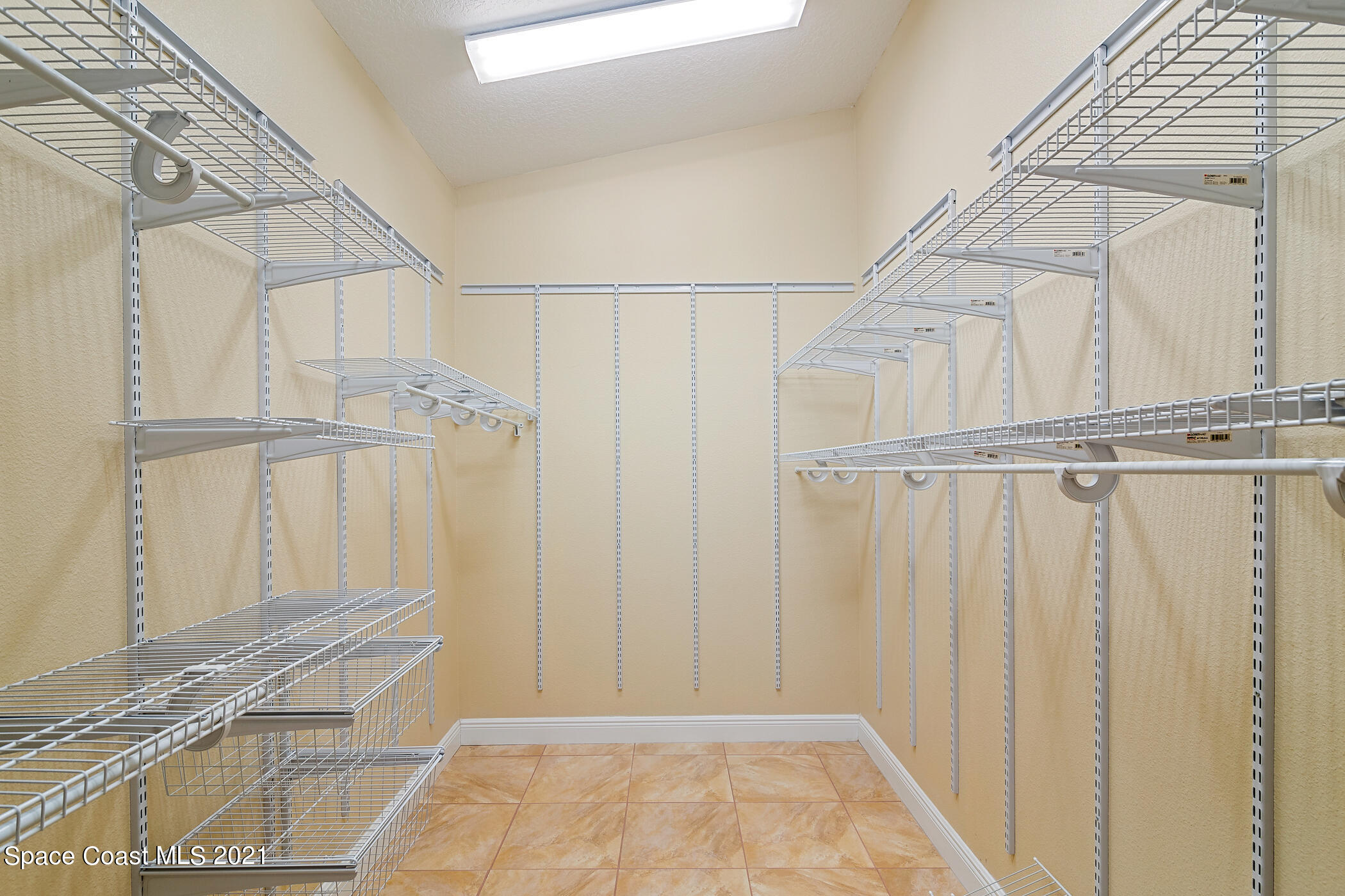 1390 Friday Road Cocoa, FL 32926 - Photo 36 of 69 a view of a room with wooden floor and white walls