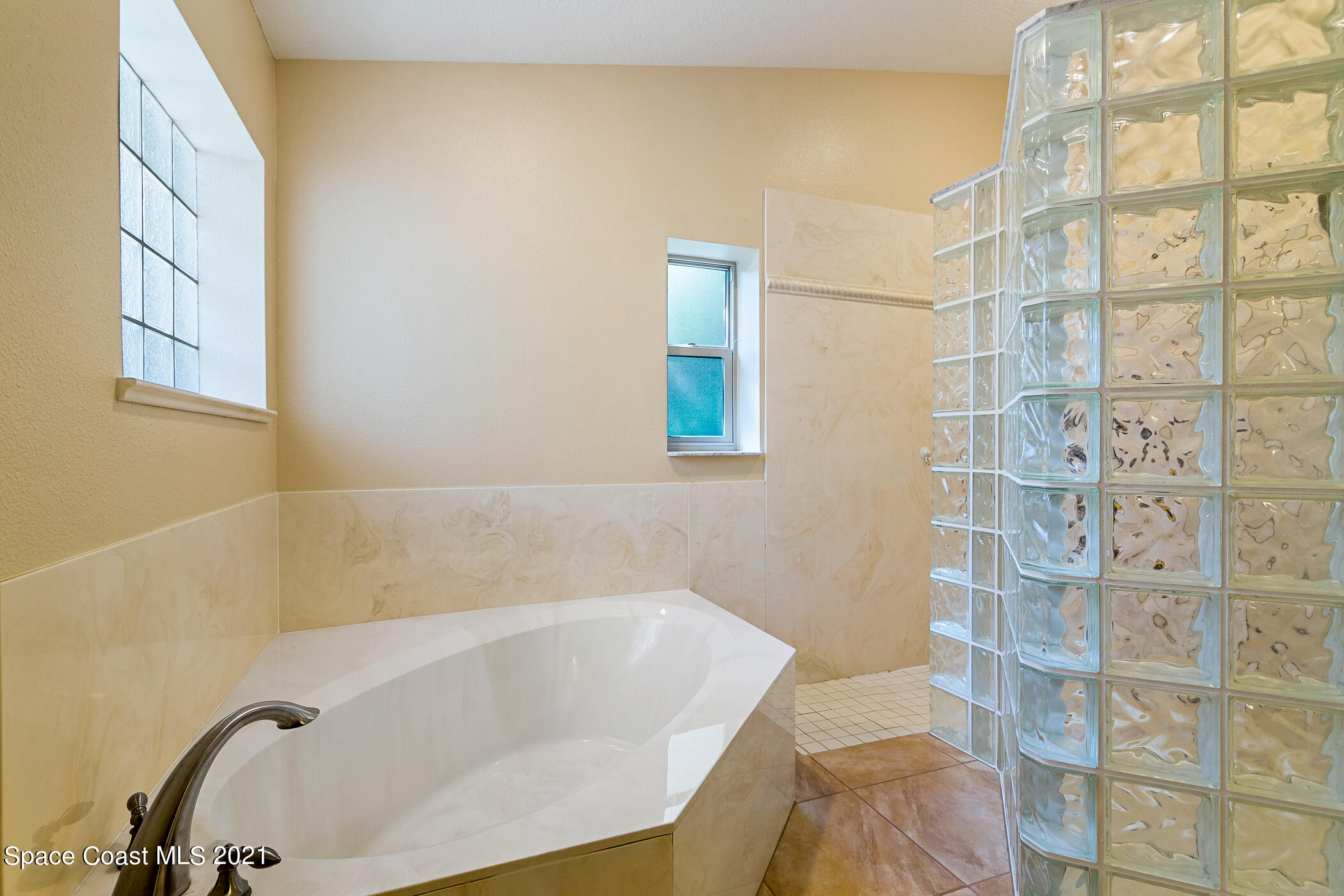 1390 Friday Road Cocoa, FL 32926 - Photo 38 of 69 a white bath tub sitting next to a shower