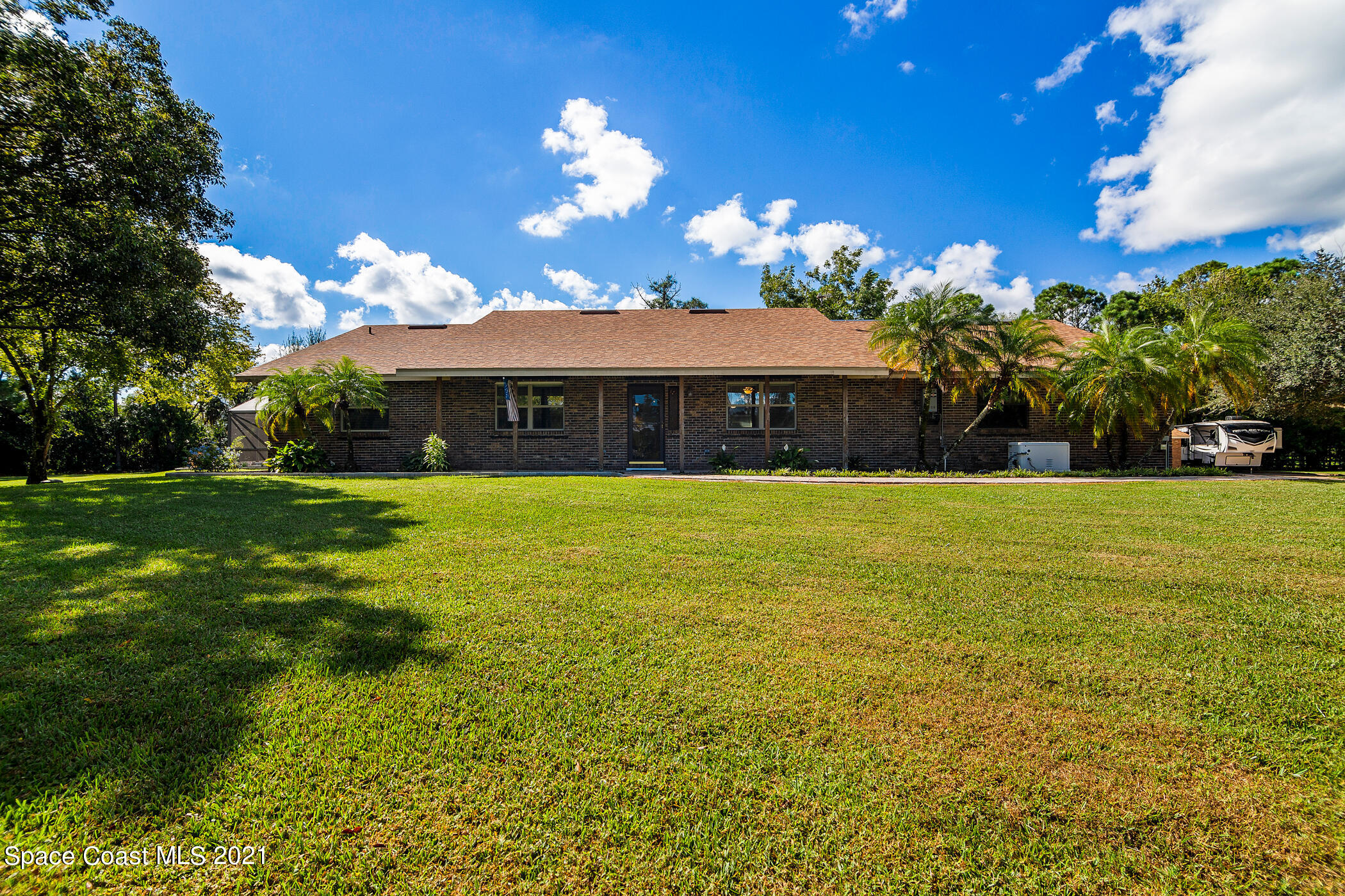 1390 Friday Road Cocoa, FL 32926 - Photo 5 of 69 a view of a house with a big yard