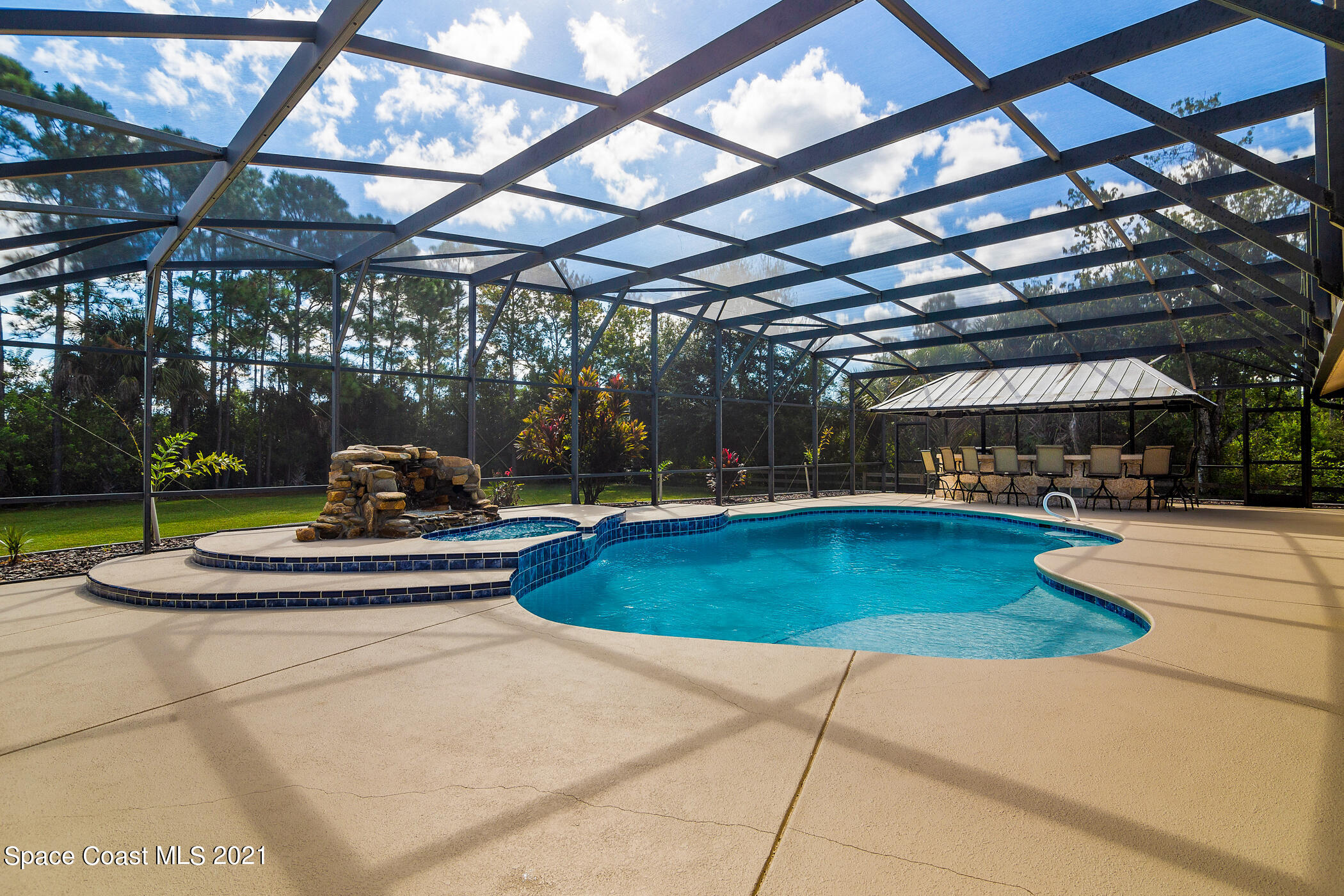1390 Friday Road Cocoa, FL 32926 - Photo 47 of 69 a view of a swimming pool with a patio