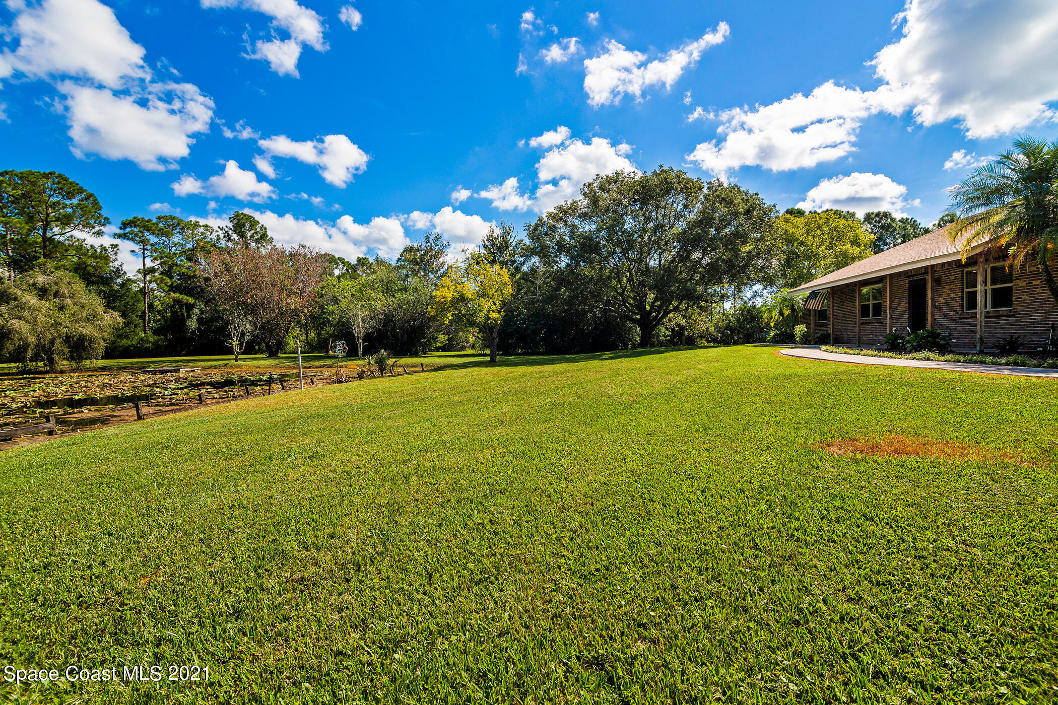 1390 Friday Road Cocoa, FL 32926 - Photo 56 of 69 a view of a house with a big yard