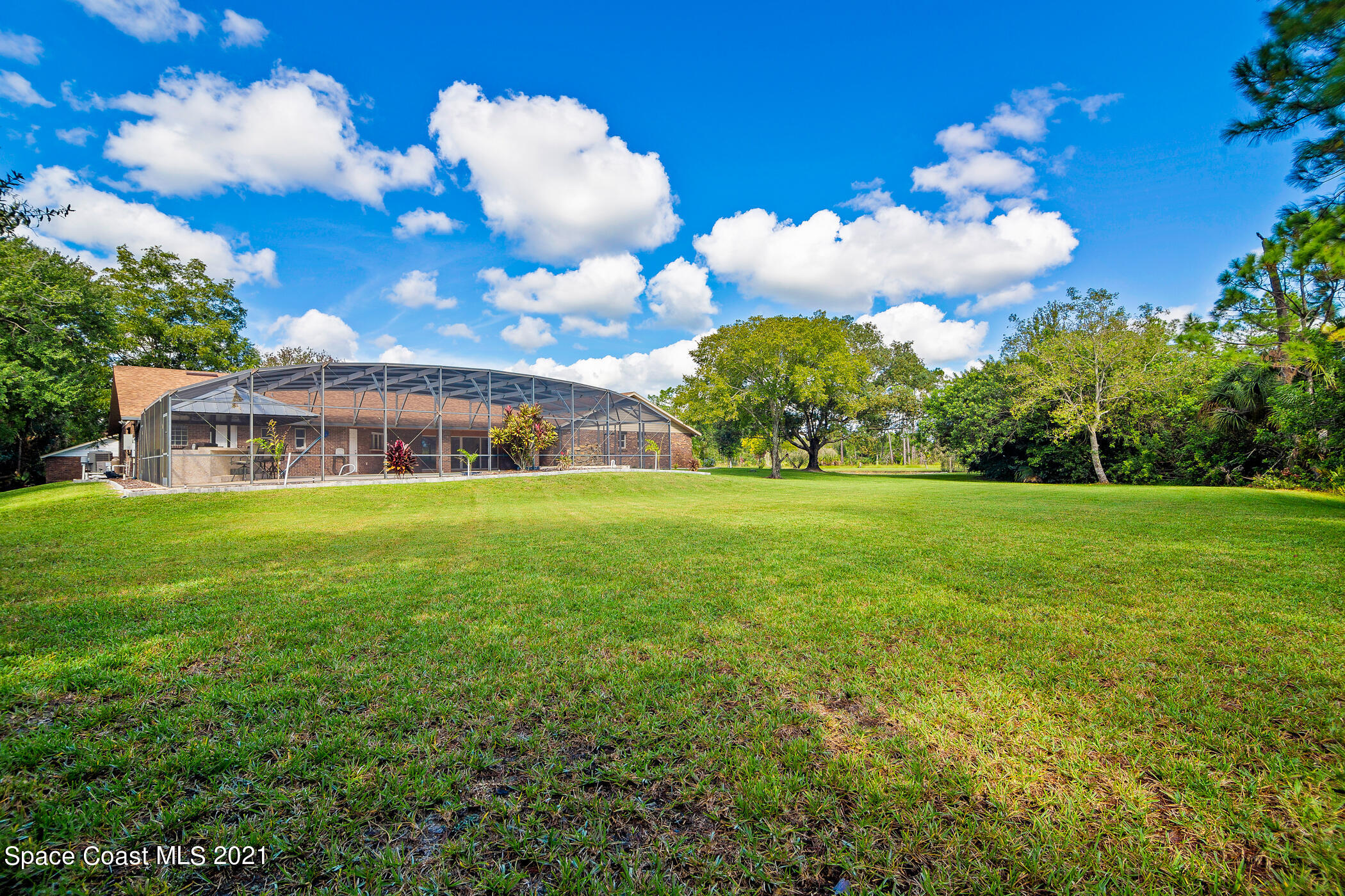 1390 Friday Road Cocoa, FL 32926 - Photo 62 of 69 a view of a house with a big yard