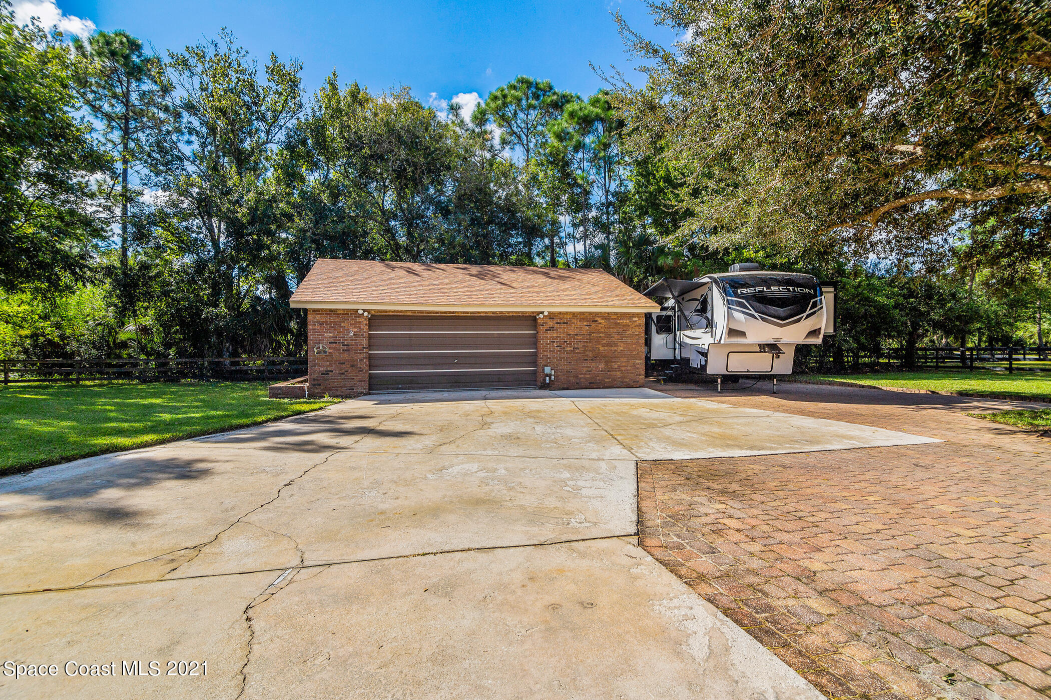 1390 Friday Road Cocoa, FL 32926 - Photo 9 of 69 a front view of a house with a yard