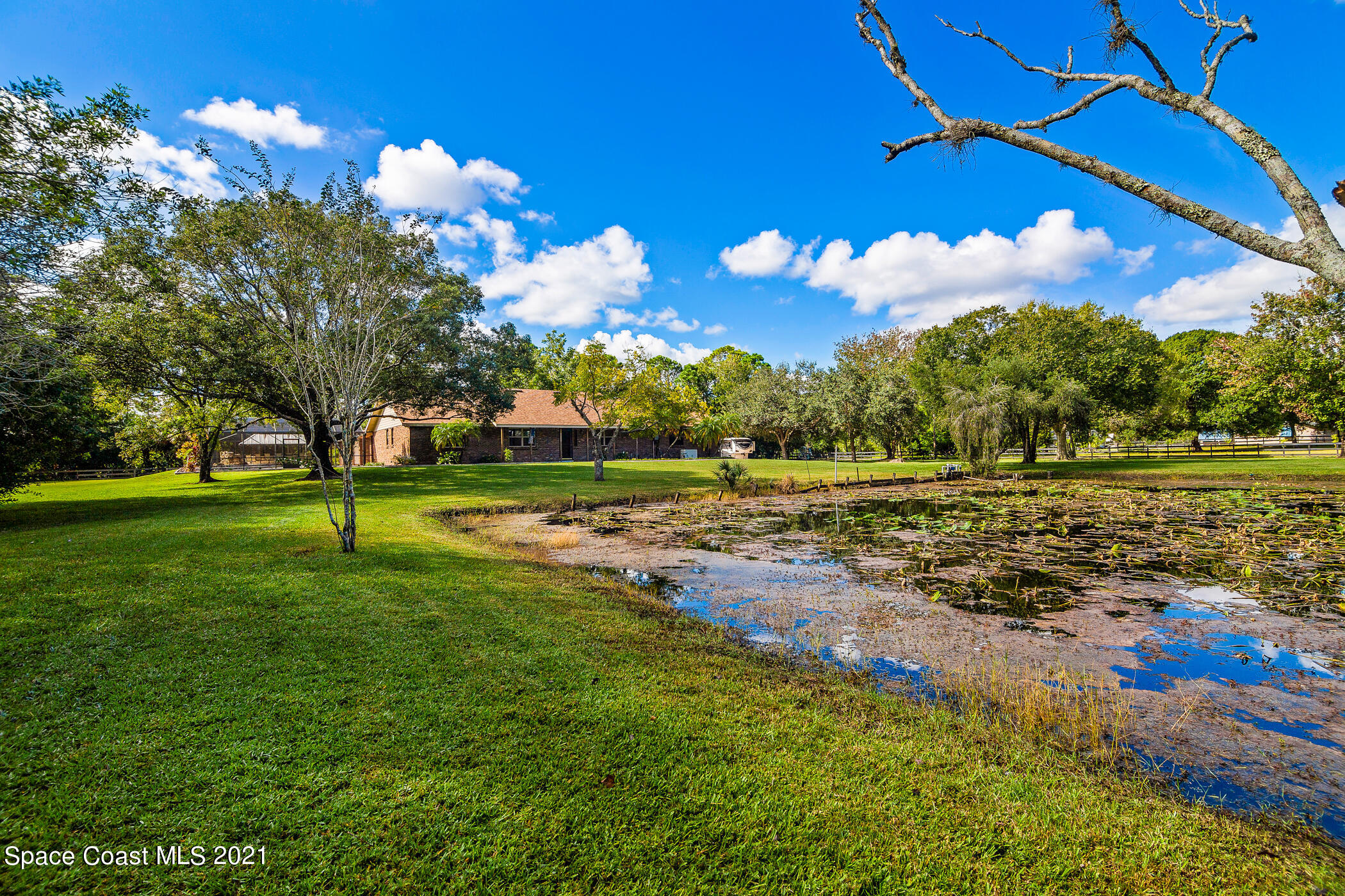 1390 Friday Road Cocoa, FL 32926 - Photo 10 of 69 a view of a golf course with a lake