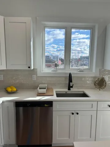 a kitchen with a sink and cabinets