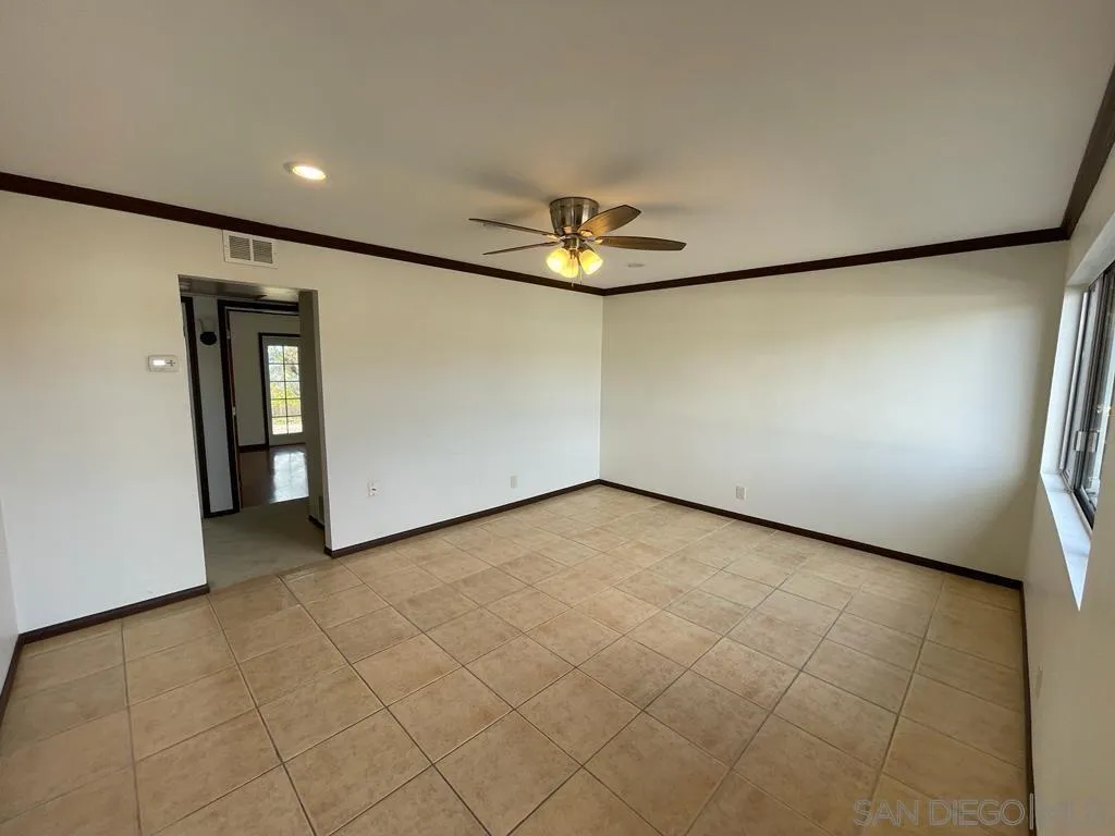 3651 North Way Oceanside, CA 92056 - Photo 5 of 16 an empty room with a empty space and wooden floor