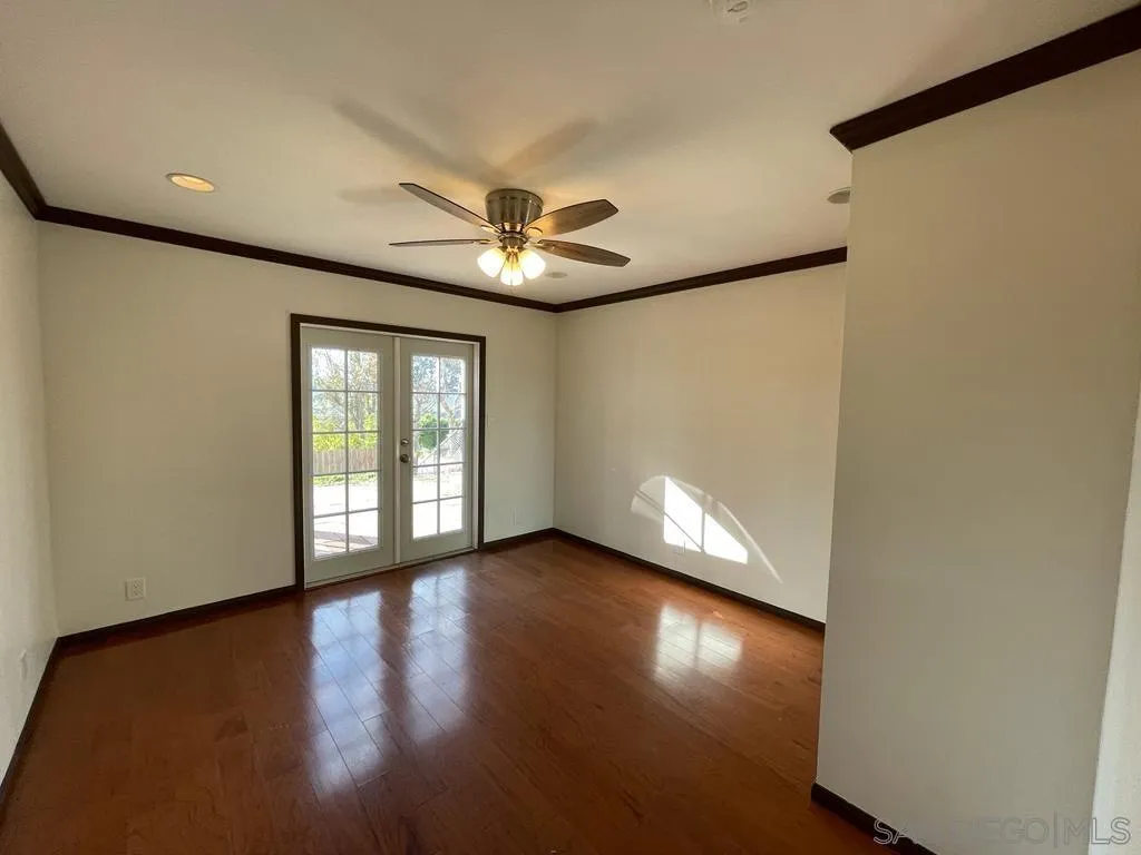 3651 North Way Oceanside, CA 92056 - Photo 8 of 16 a view of an empty room with window and wooden floor