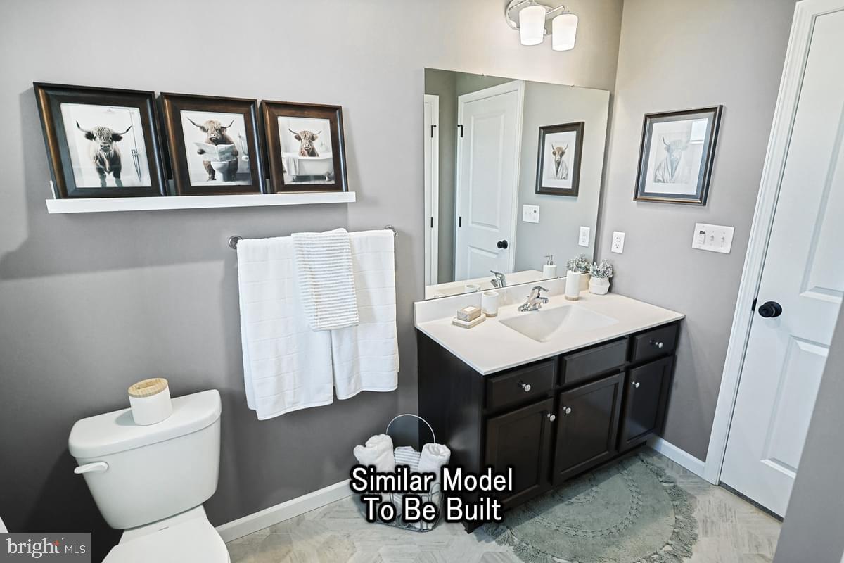 White Oak Plan At Woodlyn Preserve Selinsgrove, PA 17870 - Photo 39 of 42 a bathroom with a sink and a mirror