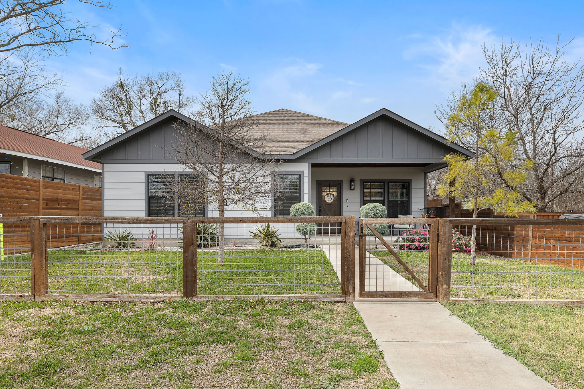 a view of a house with a yard porch and sitting area