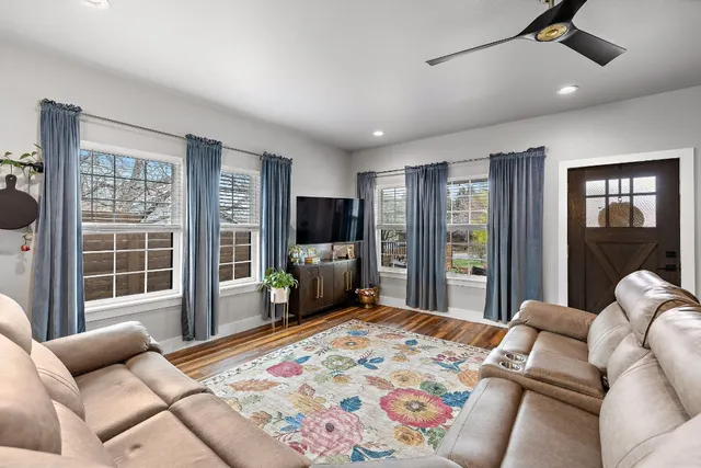 a bedroom with a balcony a bed and a couch