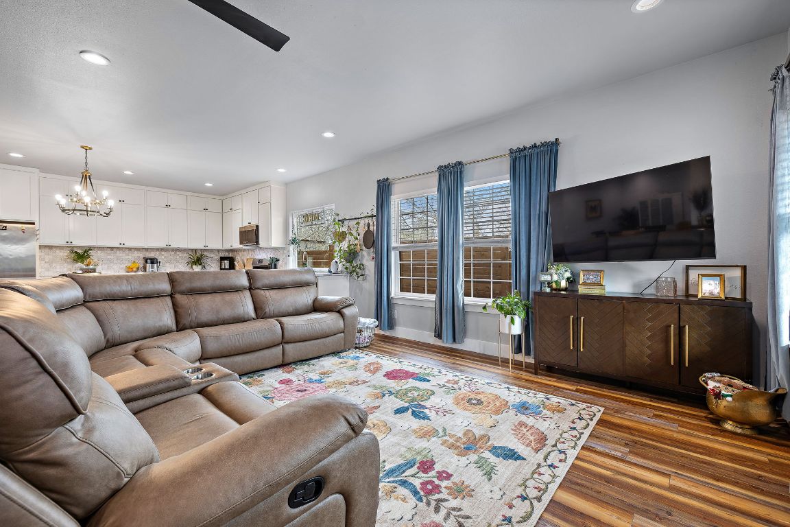 611 Elliott Street Taylor, TX 76574 - Photo 13 of 29 a living room with furniture and a flat screen tv