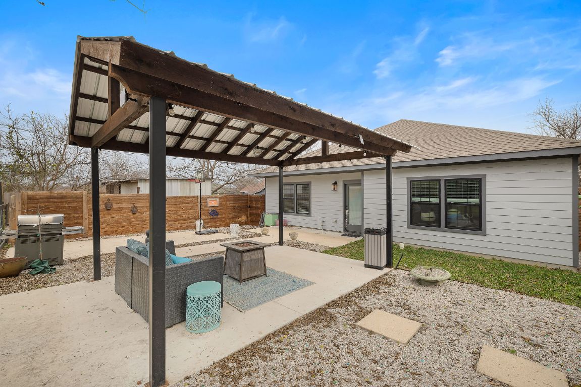 611 Elliott Street Taylor, TX 76574 - Photo 27 of 29 a front view of a house with outdoor seating