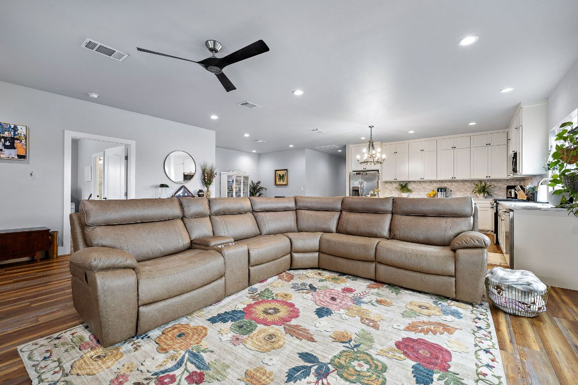 611 Elliott Street Taylor, TX 76574 - Photo 10 of 29 a living room with furniture and kitchen view