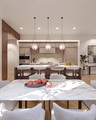 a kitchen with a stove a refrigerator and chairs