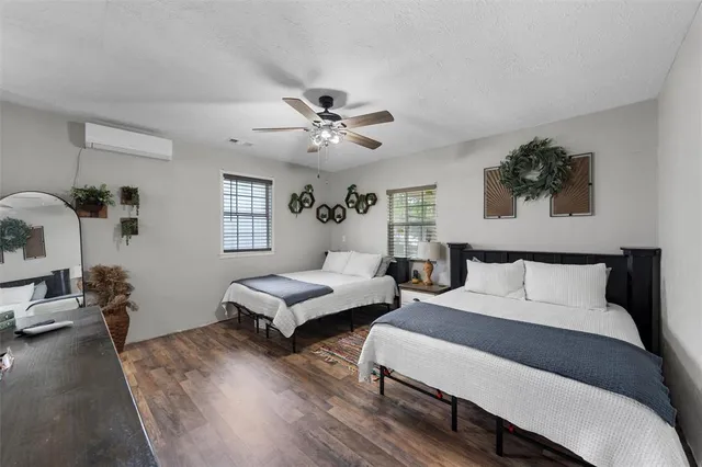 a kitchen with white cabinets and window