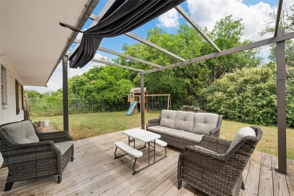 a bedroom with furniture and a window