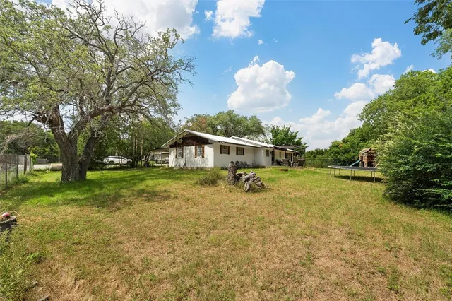 a view of backyard with green space