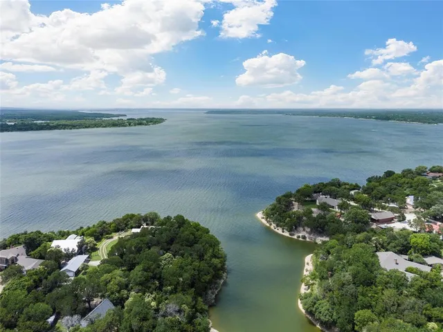 an aerial view of a house with yard swimming pool and outdoor seating