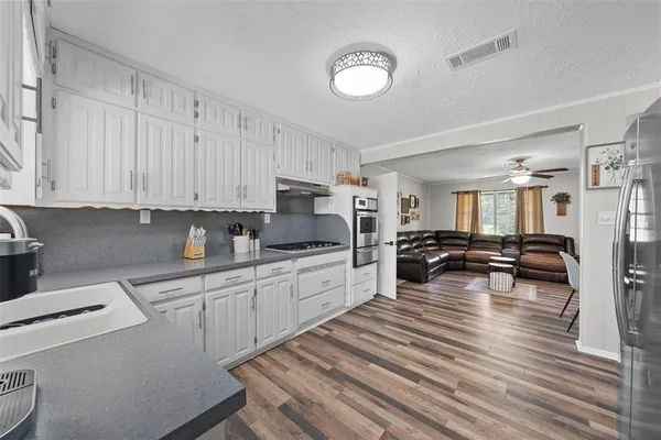 a view of a lake in a field