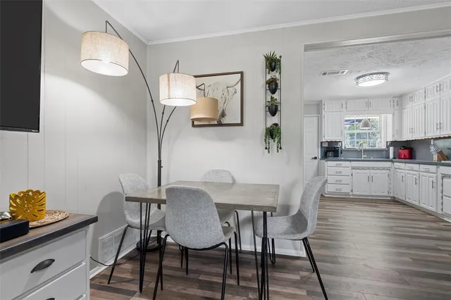 a kitchen with stainless steel appliances a refrigerator sink and cabinets