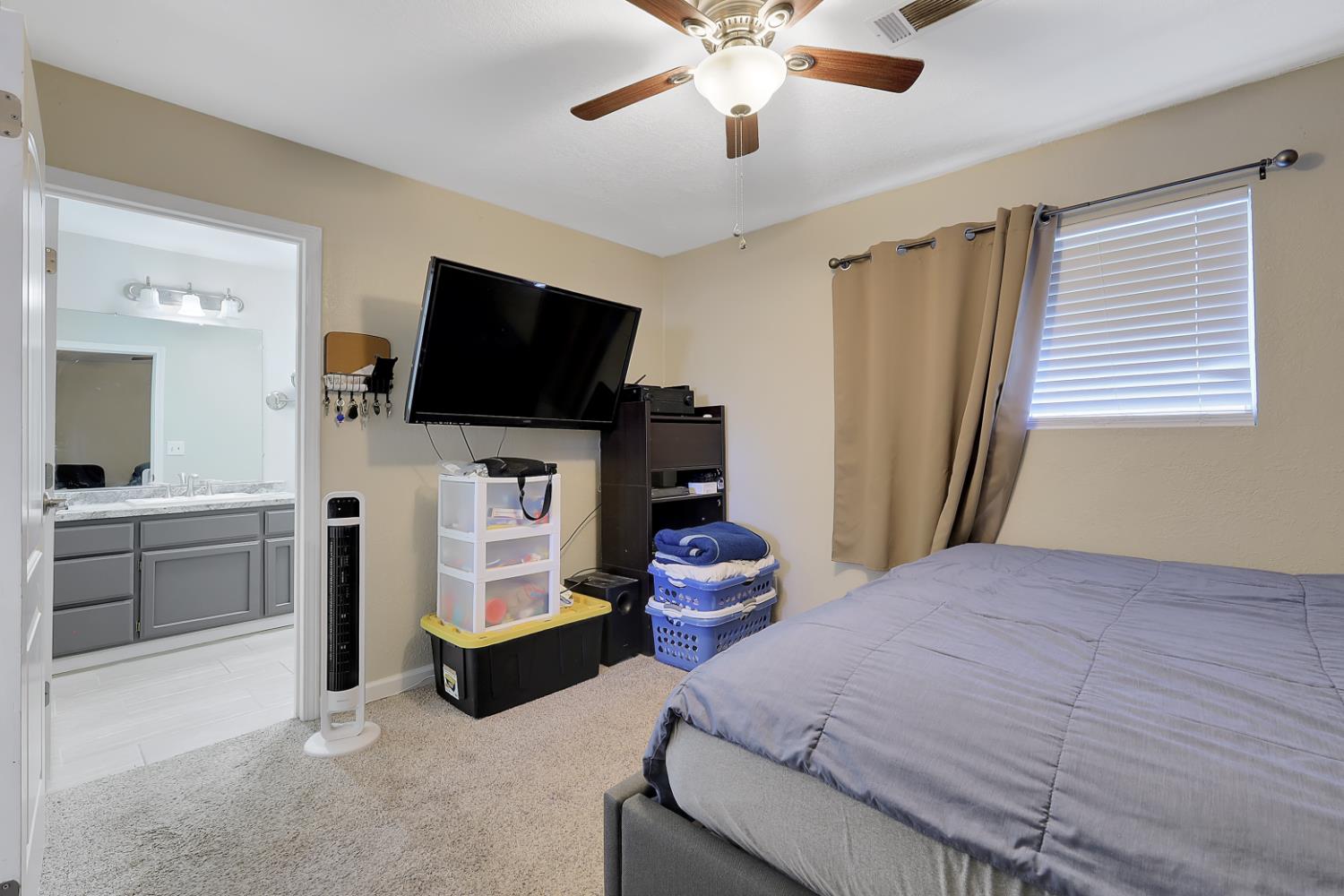 2130 Palm Street Sutter, CA 95982 - Photo 11 of 27 a bedroom with furniture and a flat screen tv