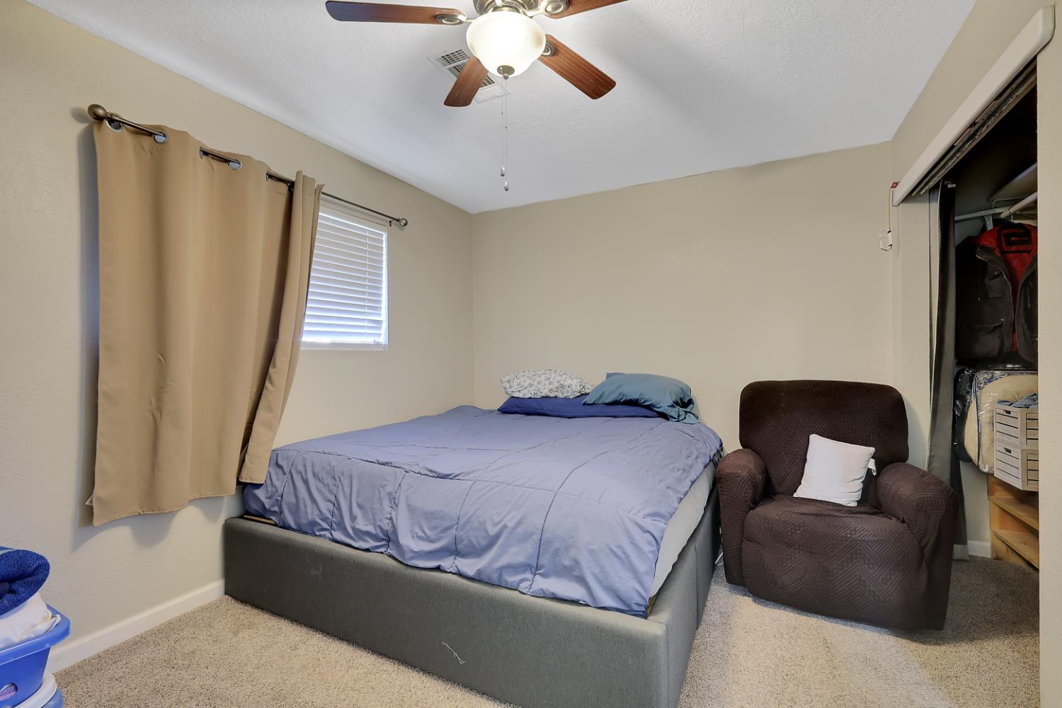 2130 Palm Street Sutter, CA 95982 - Photo 13 of 27 a bedroom with a bed couch and a large window