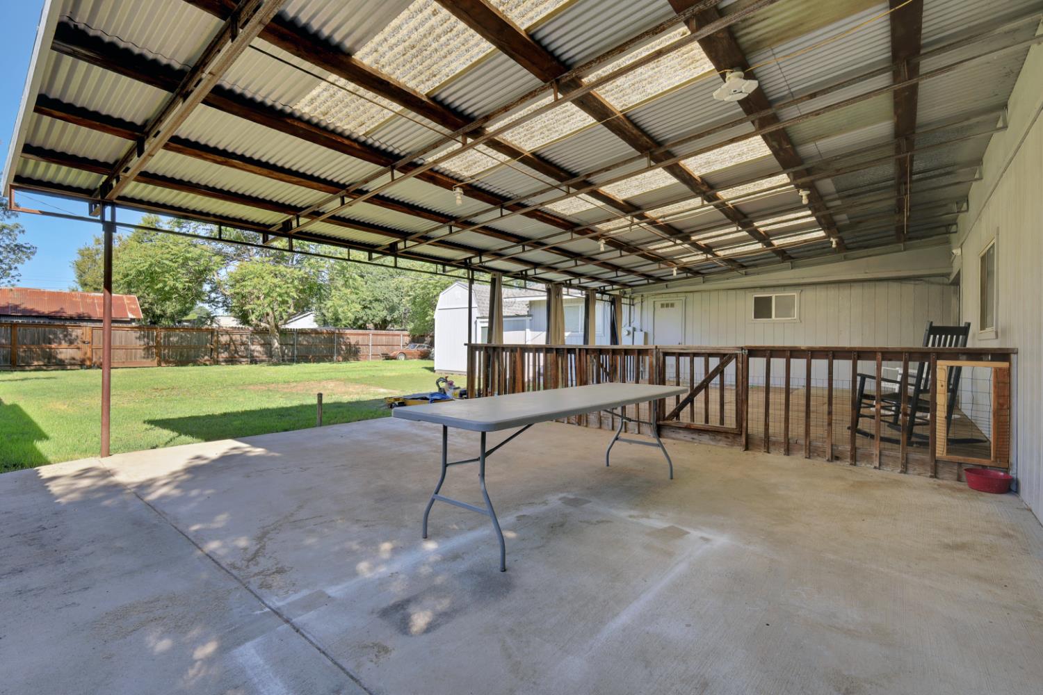 2130 Palm Street Sutter, CA 95982 - Photo 21 of 27 a view of a porch with furniture and a backyard