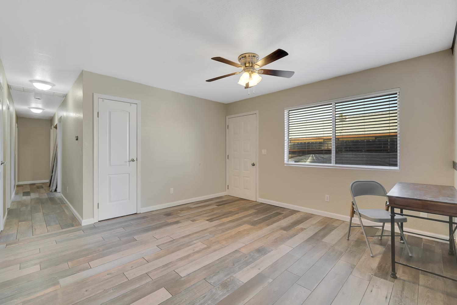 2130 Palm Street Sutter, CA 95982 - Photo 5 of 27 a view of workspace with wooden floor and windows