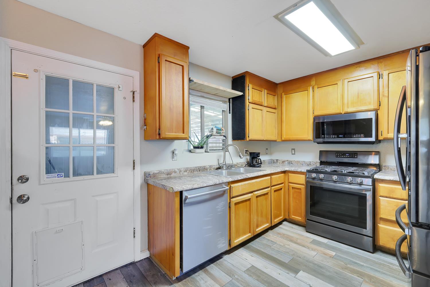 2130 Palm Street Sutter, CA 95982 - Photo 6 of 27 a kitchen with stainless steel appliances granite countertop a stove and a sink