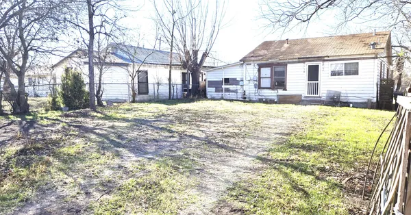 a view of a house with snow on the ground and covered with snow